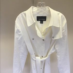 White, double breasted trench coat.